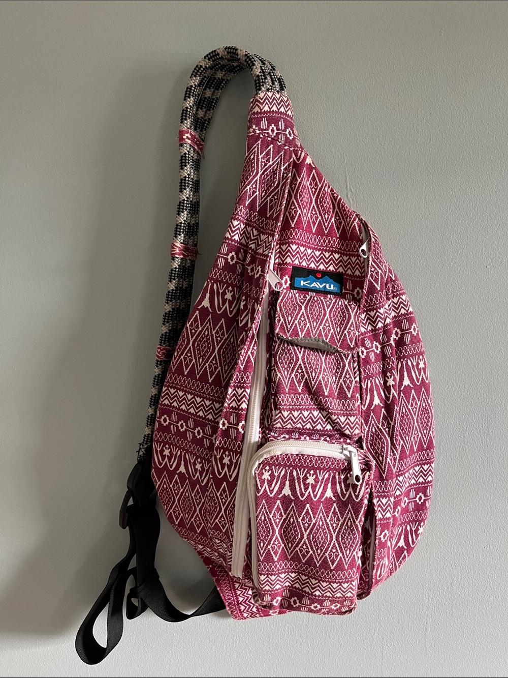 KAVU Raspberry Patterned Sling Backpack in Pink and Black Strap